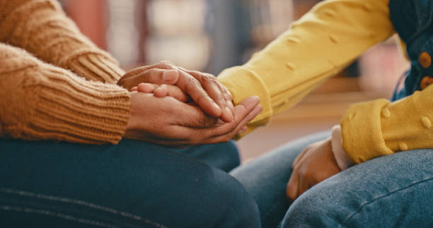 istockphoto-1460014746-612x612 Hands, love and care touching in support, trust or unity for community, compassion or understanding. People holding hands in respect for loss, affection or passion for listening, talk or time