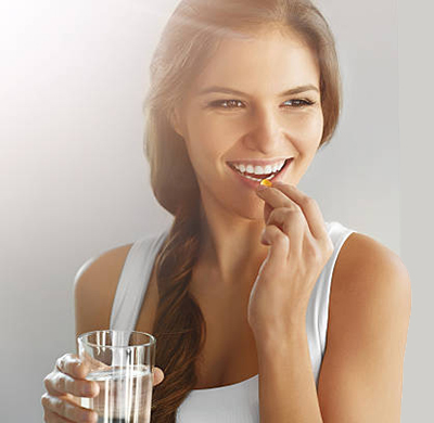 woman-taking-supplement woman-taking-supplement